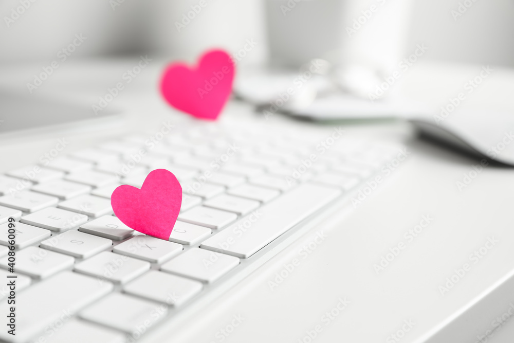 Keyboard with pink hearts on white table, closeup. Valentine's day celebration - obrazy, fototapety, plakaty 