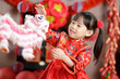 © M-image - young chinese girl with traditional dressing up celebrate Chinese new year