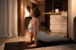 © Cavan Images - Slim woman stretching body during yoga lesson