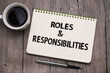 Roles and Responsibilities, text words typography written on book against wooden background, life and business motivational inspirational