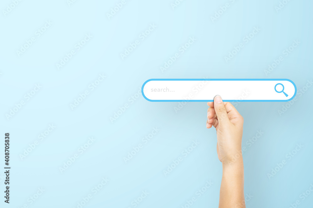 Hand holding paper with search bar on light blue background. Concept of searching information data on internet networking - obrazy, fototapety, plakaty 