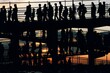 © SuperStock - Silhouette of people walking down a ramp at sunset
