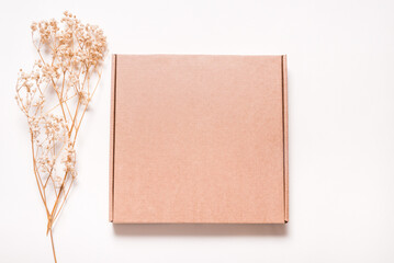 Brown Carton box decorated with dried grass