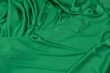 Fabric satin silk drapery. Green textile