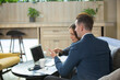 © FotoArtist - Business people talking in office using digital tablet and computer