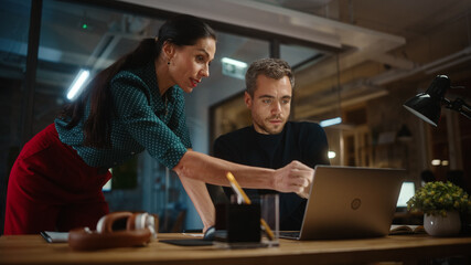 Aufkleber - Handsome Young Project Manager and Beautiful Creative Director Work and Talk About Business Strategy on a Laptop Computer in Creative Office. Life of a Busy Marketing Agency in Modern Loft Building.