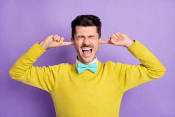 Sticker - Portrait of brunet stressed guy close ears yell wear yellow sweater isolated on pastel lilac color background