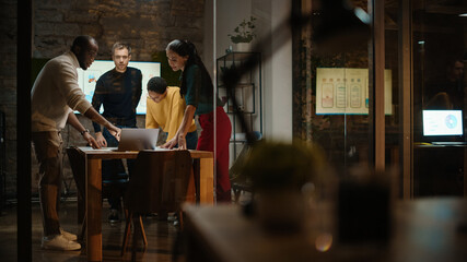 Aufkleber - Diverse Multiethnic Team are Having a Conversation in a Meeting Room Behind Glass Walls in a Creative Office. Colleagues Lean On a Conference Table and Discuss Business, App User Interface and Design.