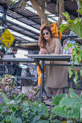 Wall Mural - Asian Woman in Coffee Shop at Phu Langka Viewpoint