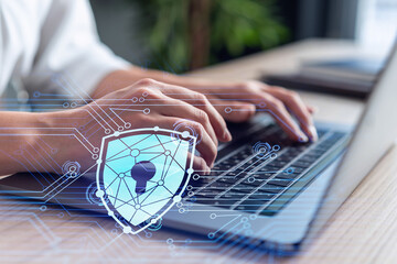 a woman programmer is typing a code on computer to protect a cyber security from hacker attacks and 