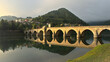 Beautiful bridge over the Drina river illuminated by morning sun.