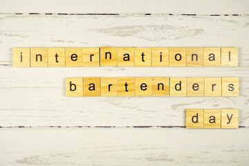 International Bartender's Day.words from wooden cubes with letters