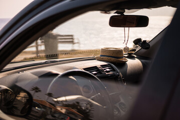 Sticker - View inside a car with a hat on the dashboard