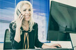 © Mangostar - Happy grey-haired businesswoman talking with colleague on phone. Professional confident manager chatting, smiling and working on computer. Business, workplace and communication concept