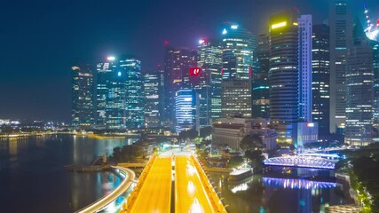 Wall Mural - Hyper lapse video 4K, Aerial view traffic with background Singapore landmark financial business district with skyscraper, traffic into city on February 2, 2020 in Singapore.