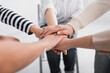 © LIGHTFIELD STUDIOS - partial view of group of women holding hands together during seminar