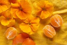 Orange Primroses And Fruits On The Orange Linen Fabric