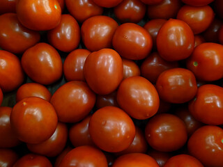 lot of tomatoes in the market closeup photo