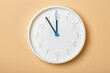 © stasknop - white wall clock with blue second hand show eleven o'clock