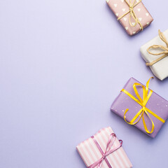 Purple gift boxes on purple background. flat lay, top view, copy space