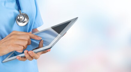 Poster - Doctor at hospital working with tablet pc