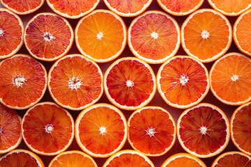 Wall Mural - Pattern of sliced oranges prepared for juice making