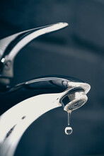 Water Drop Dripping From The Tap And Water Shortage	