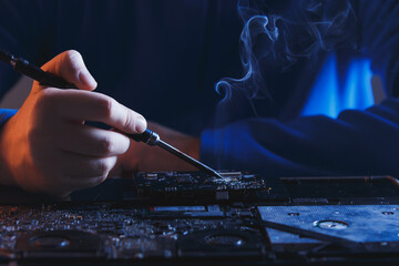computer hardware engineering. technology science concept. developer soldering electronic component