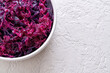 Fermented purple cabbage on a white background with copy space