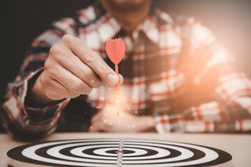 Targeting the business concept, Businessman throwing red arrow dart to virtual target dart board,Executive marketing, investment goal and target for business investment concept.