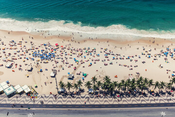 Wall Mural - High angle view of Copacabana beach full of people relaxing on the sun, Rio de Janeiro