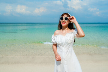 Wall Mural - cheerful woman on sea beach at Koh MunNork Island, Rayong, Thailand