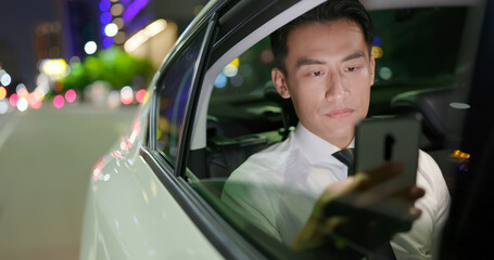 Canvas Print - businessman use phone in car