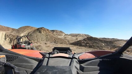 Wall Mural - Driving and Offroad vehicle down a desert road