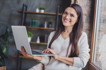 Poster - Photo of attractive charming lovely pretty happy positive cheerful smiling woman in glasses working in laptop at home house