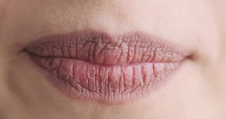 close up of female mouth speaking to camera