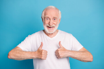 Sticker - Photo portrait of old man showing two thumbs up isolated on pastel blue colored background