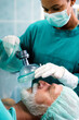 Anesthesiologist doctor anesthetized a surgical patient in hospital.