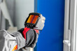 A thermal imager in the hands of an electrician conducting an inspection of the equipment
