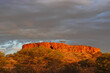 © Pidjin - Golden hour sunlight, shining on a desert breakaway hill, goldfields outback Australia.