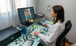 © David Pereiras - Woman talking on video call with computer with her doctor