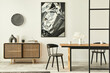 Leinwandbild Motiv Stylish scandinavian living room interior of modern apartment with wooden commode, design table, chairs, carpet, abstract paintings on the wall and personal accessories in unique home decor. Template.