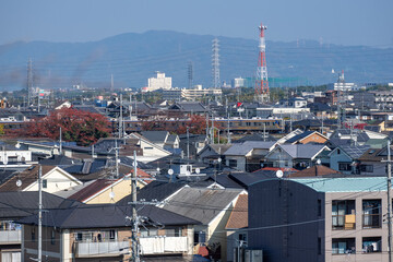 Wall Mural - 南大阪の市街地を走る電車風景と奥に見える信貴山と生駒山