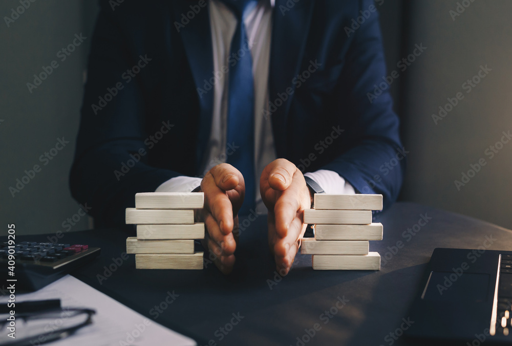 Businessman separates wooden block. Concept of wealth equality. Division of property. Divorce and legal services.	
 - obrazy, fototapety, plakaty 