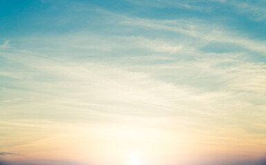 Wall Mural - orange sunrise sky background in the morning with colorful sunset cloud.