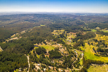 Wall Mural - amazing aerial view of the chilean countryside with the trees in the forest and agricultural fields 