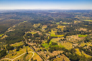 Wall Mural - amazing aerial view of the chilean countryside with the trees in the forest and agricultural fields 