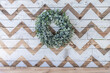 Lamb's Ear wreath on reclaimed wooden natural and white, chevron-patterned background over mantle