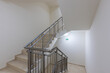 © dechevm - Modern stair case between floors. Stairs with metallic rail  in modern building