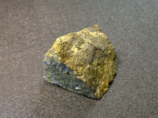 the mineral is a stone chip with yellow inclusions